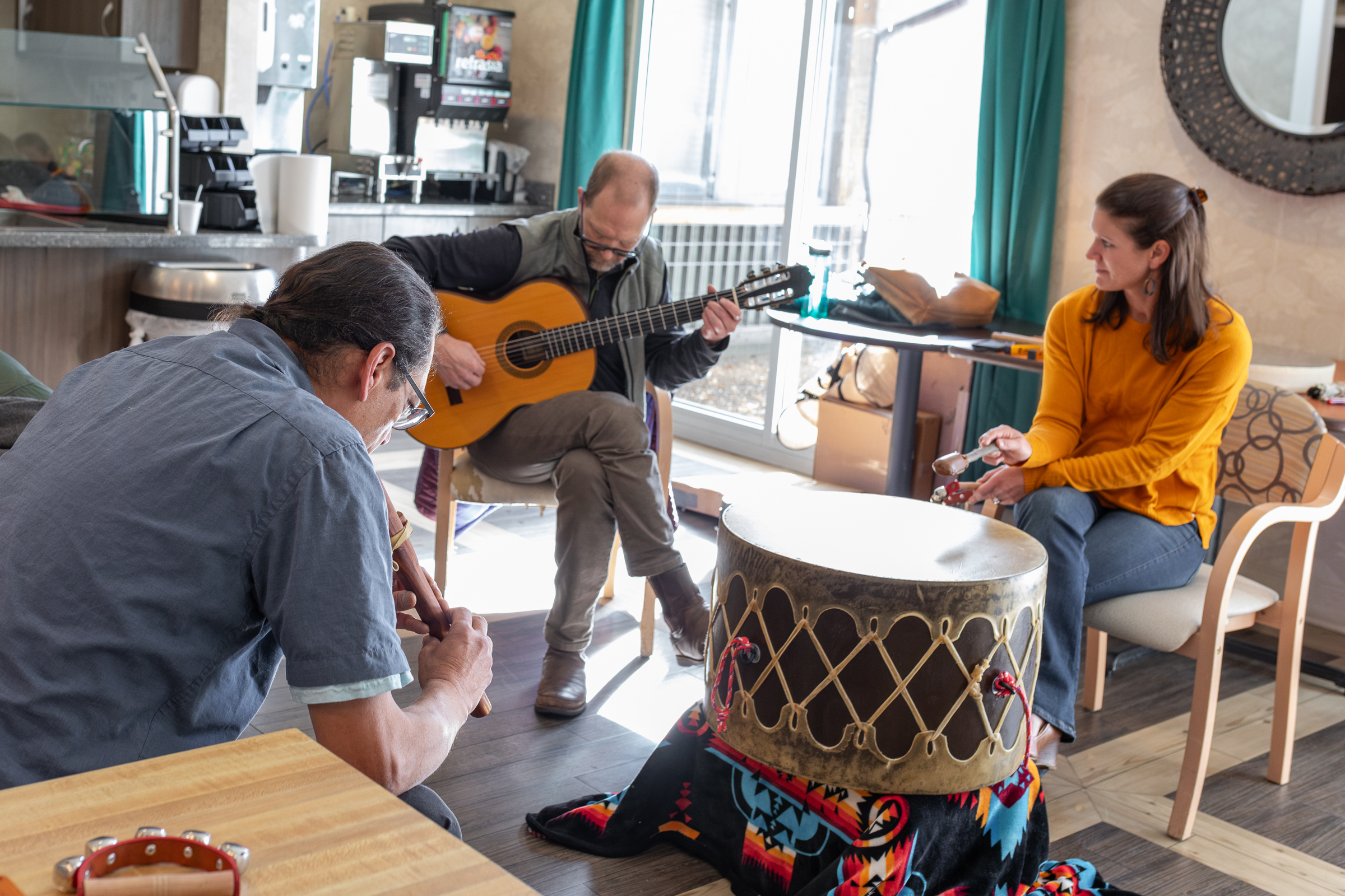 Larry Peterson, Craig Yarbrough, and Katherine Mommaerts lead an active music session for participants at Haven Health.