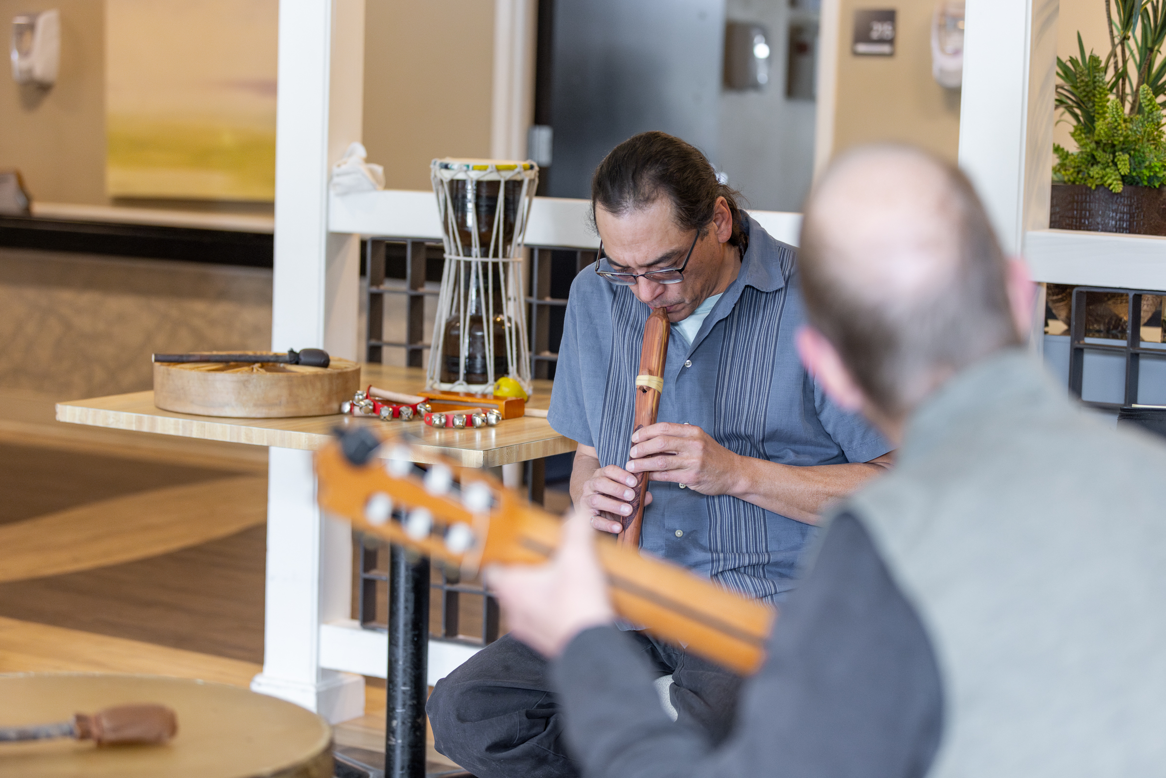 Larry Peterson engaging in music playing with Craig Yarbrough looking for cues from Larry while playing together.