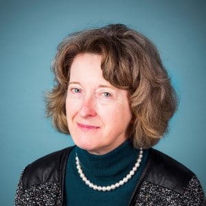 Margaret Heitkemper, RN, PhD, FAAN portrait wearing a teal shirt with a black jacket.