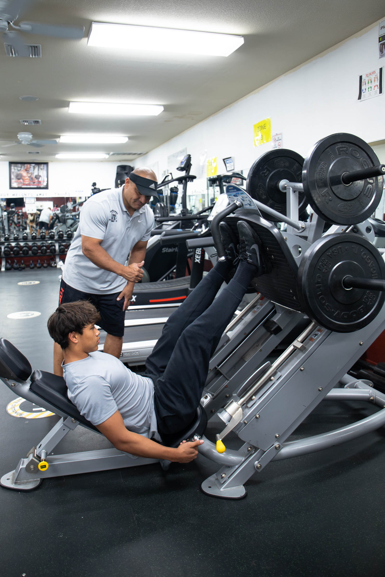 Damon Romo provides personal training to a community member.