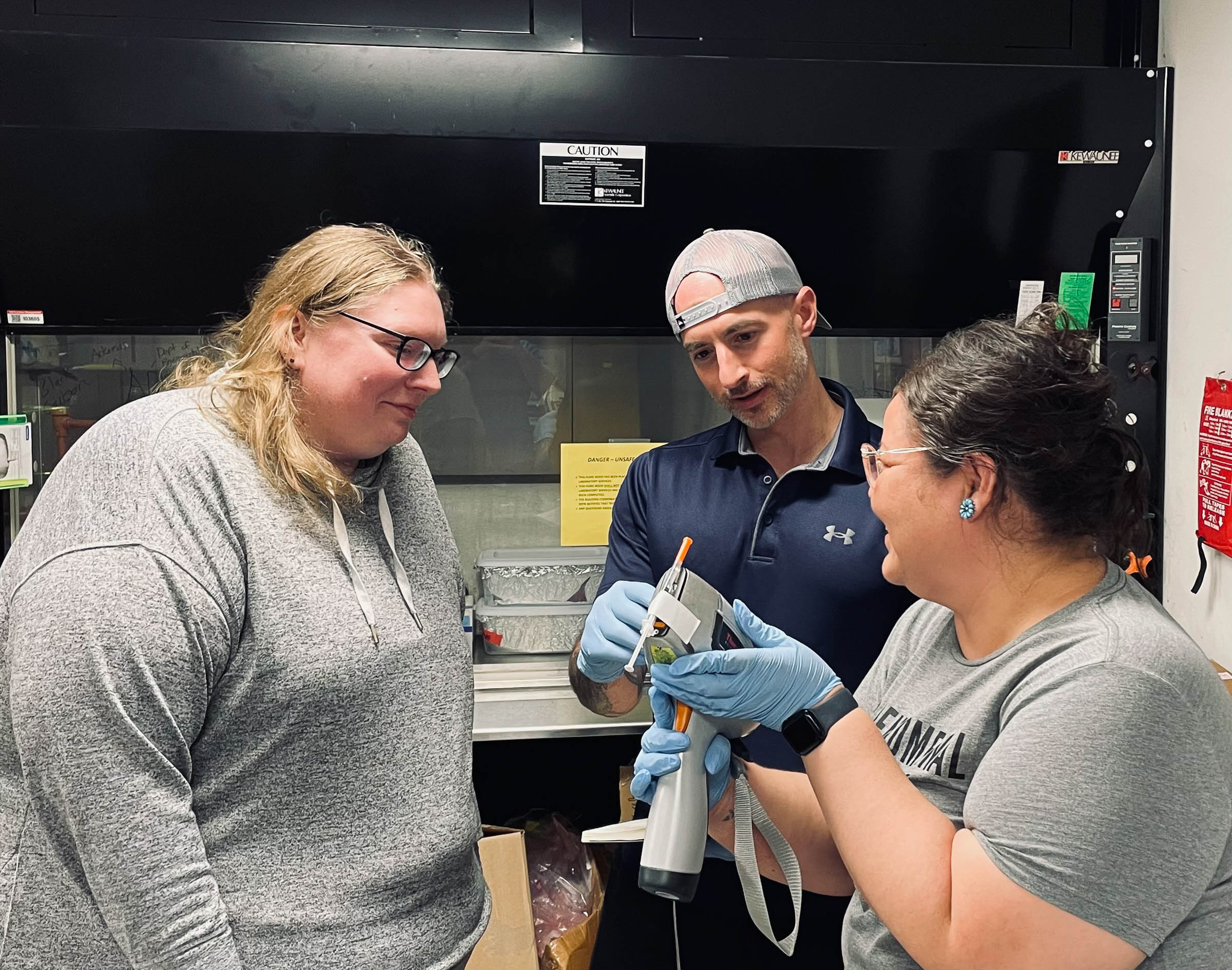 Goodluck (right) working in Roper's (left) laboratory at the University of Mississippi.