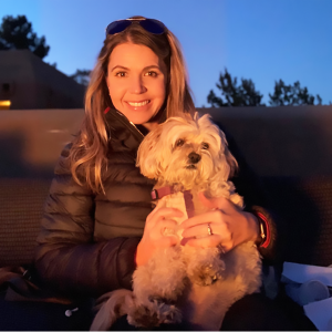 Headshot of Bonnie Kuss holding a small dog.