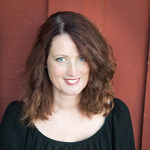 Lisa Hardy posing for portrait wearing a black top.