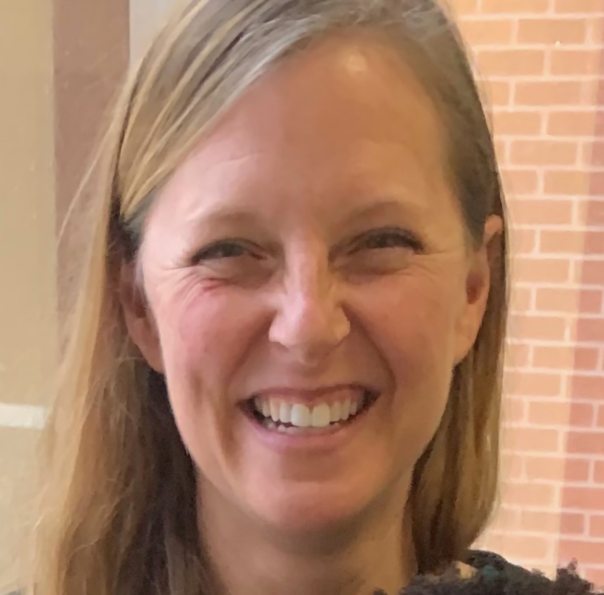 Maureen McGarrity Yoder smiling for a portrait.