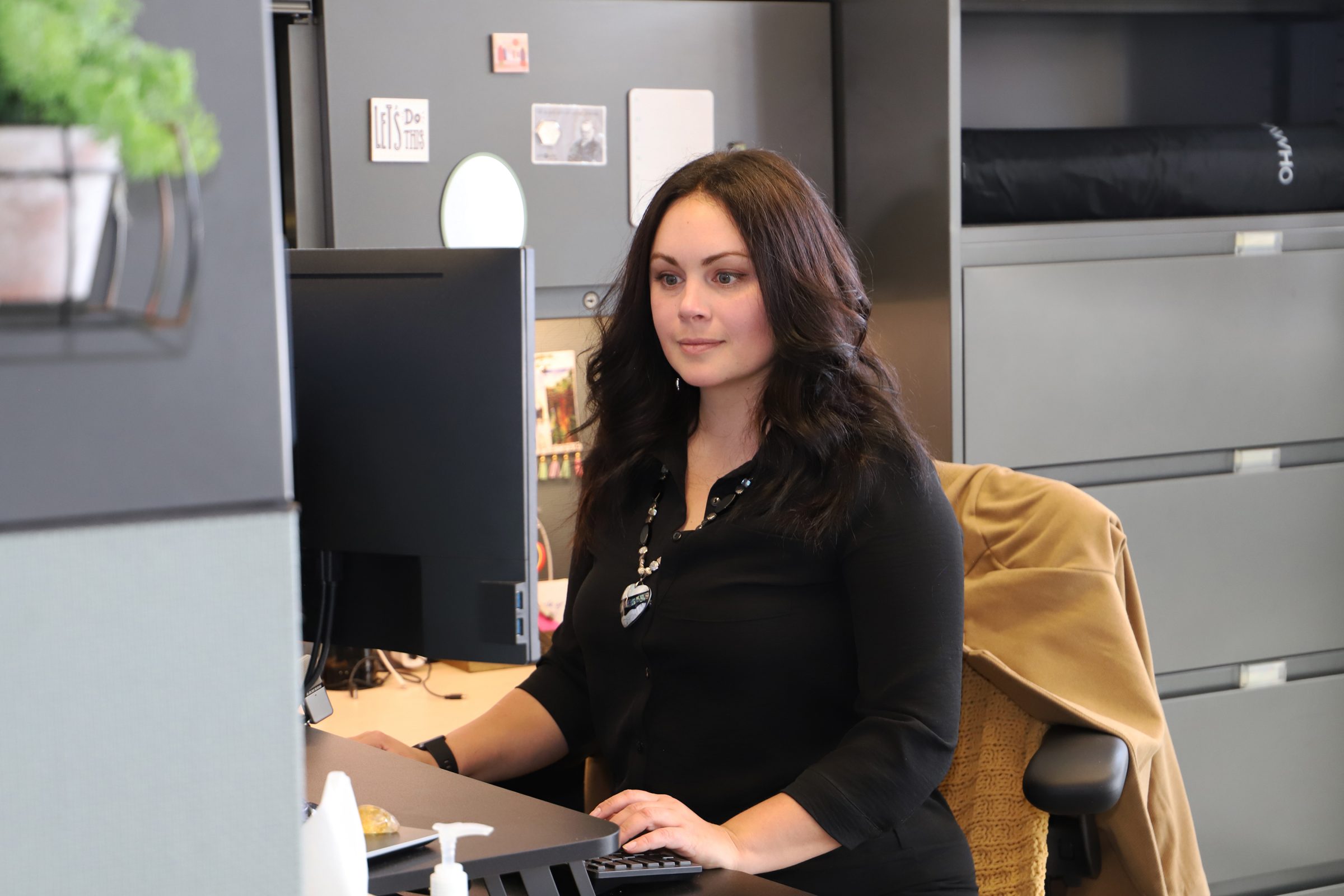 Melinda Smith working at her desk at the Center for Health Equity Research. 