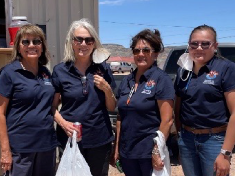 Priscilla Sanderston and three other members of the Navajo Healthy stomach program pose with bags of lunch.