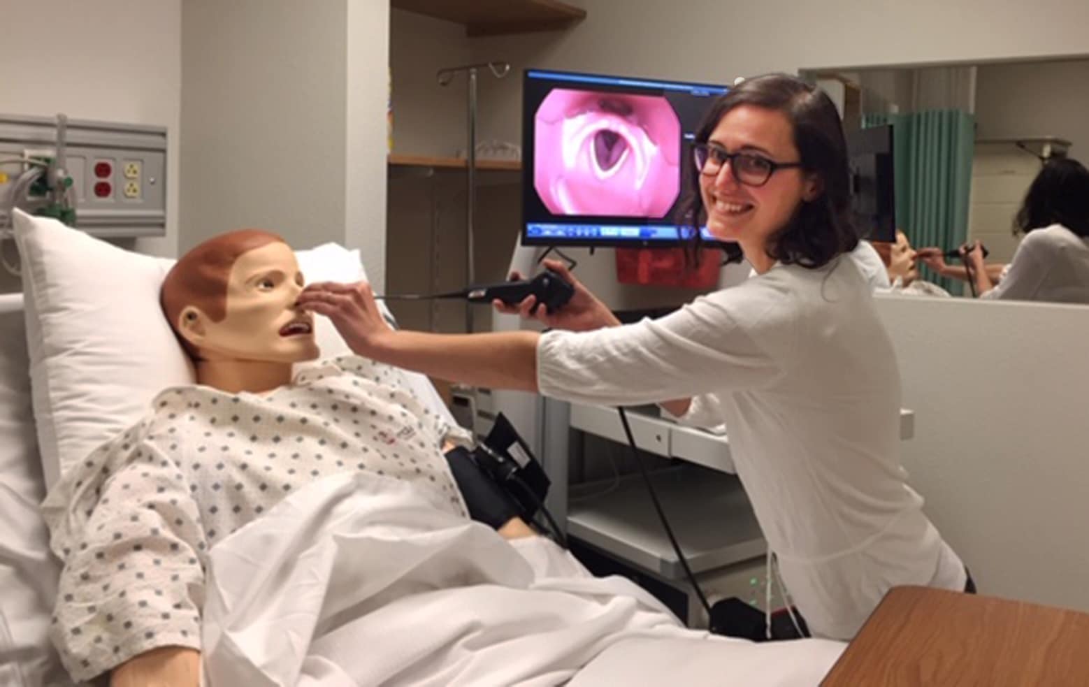 Rebecca Bartlett working a manikin patient.