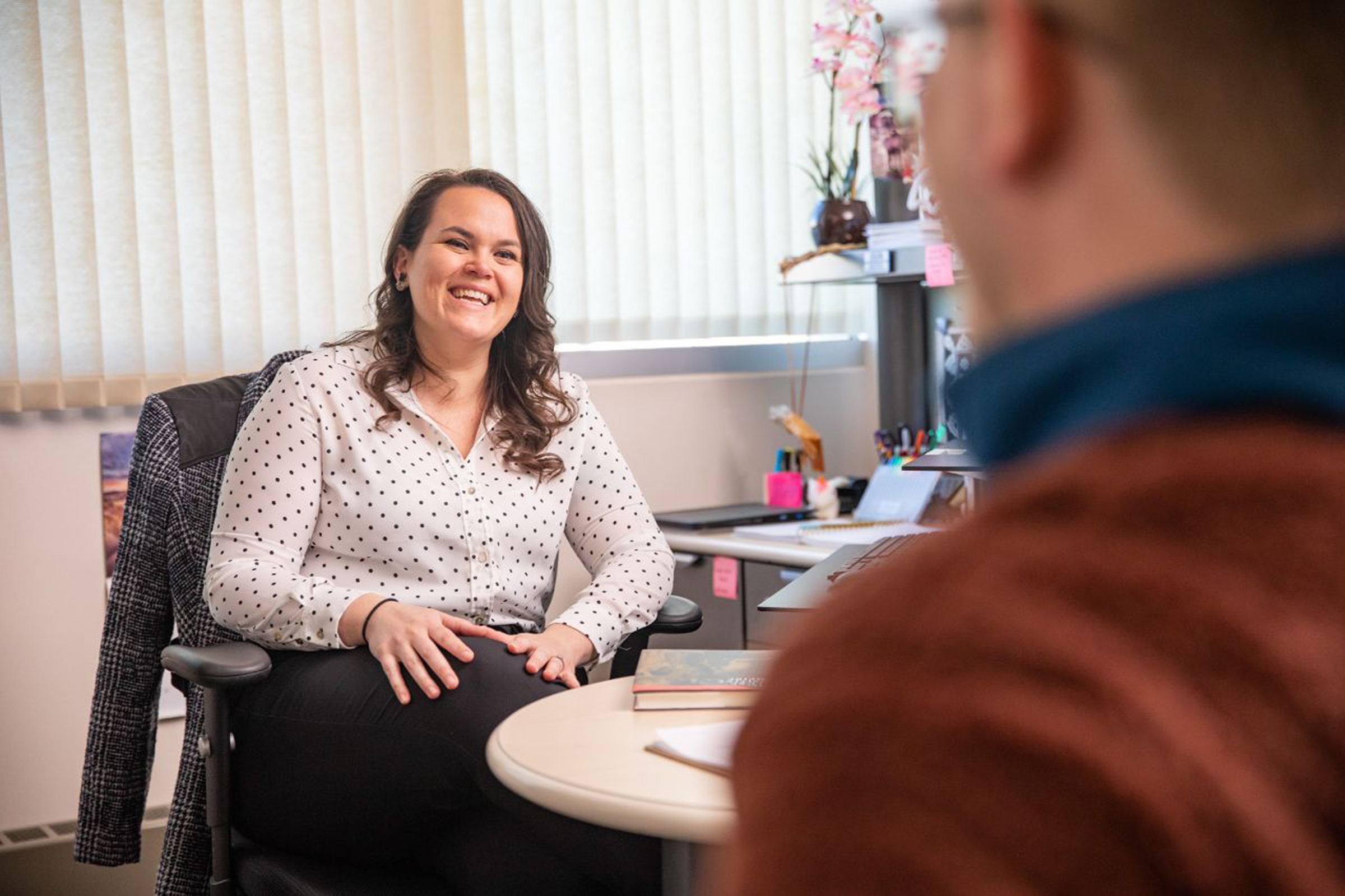 Ricky Camplain talking to someone in her office.