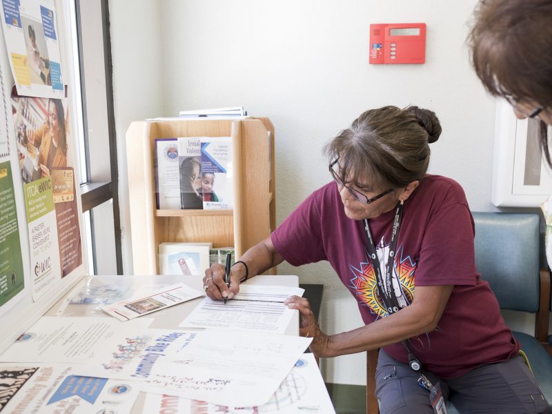 A CHR works on paperwork.