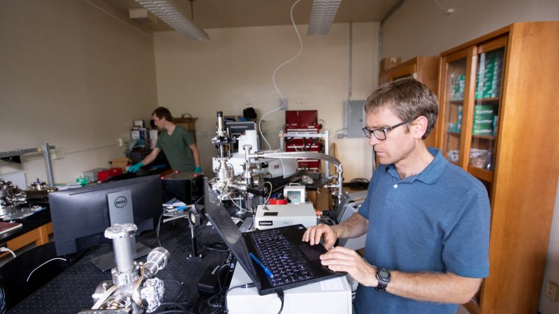 Professor mark loeffler working on his computer.