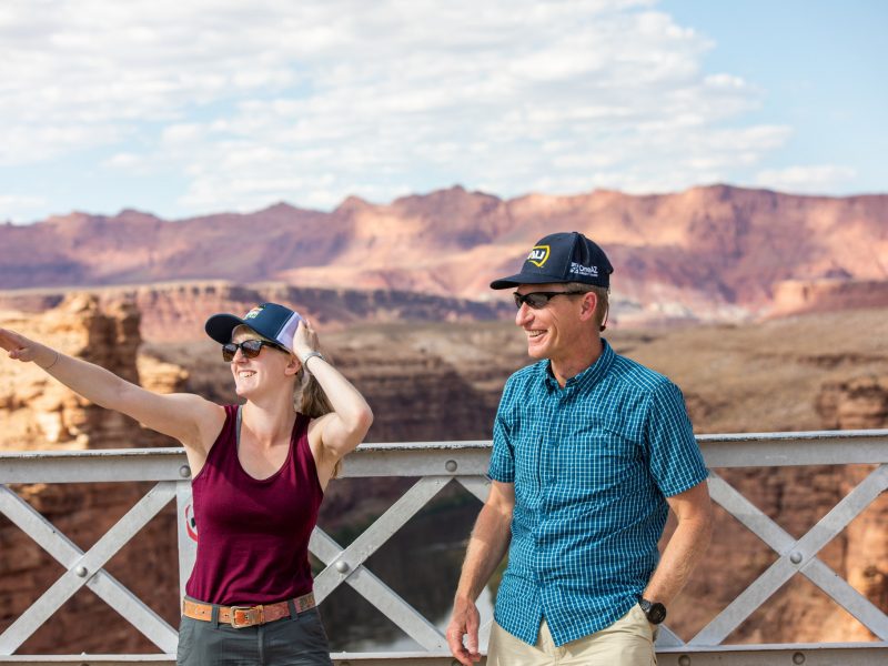 Student and faculty member looking in the distance at the grand canyon.