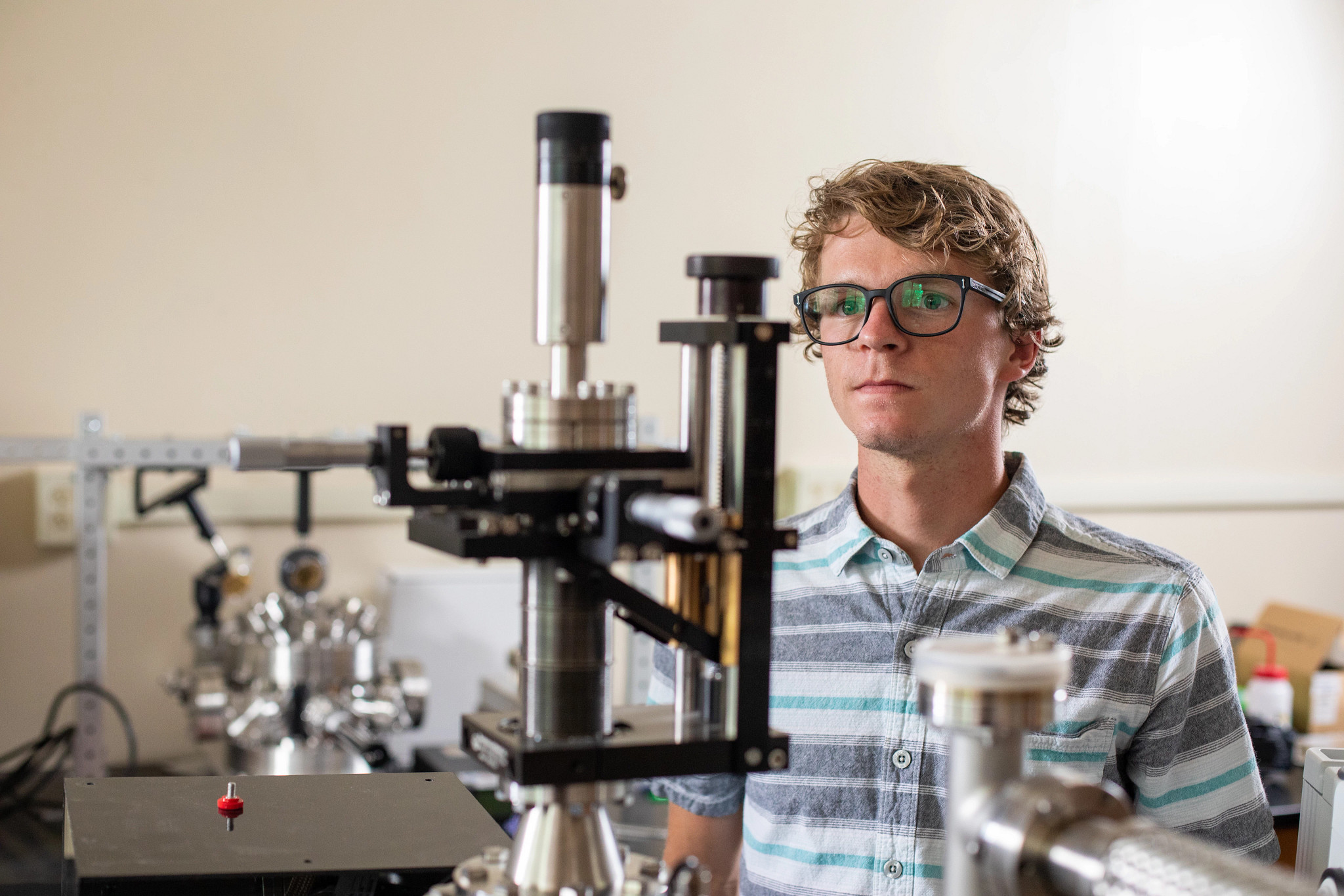 Student observing a microscope