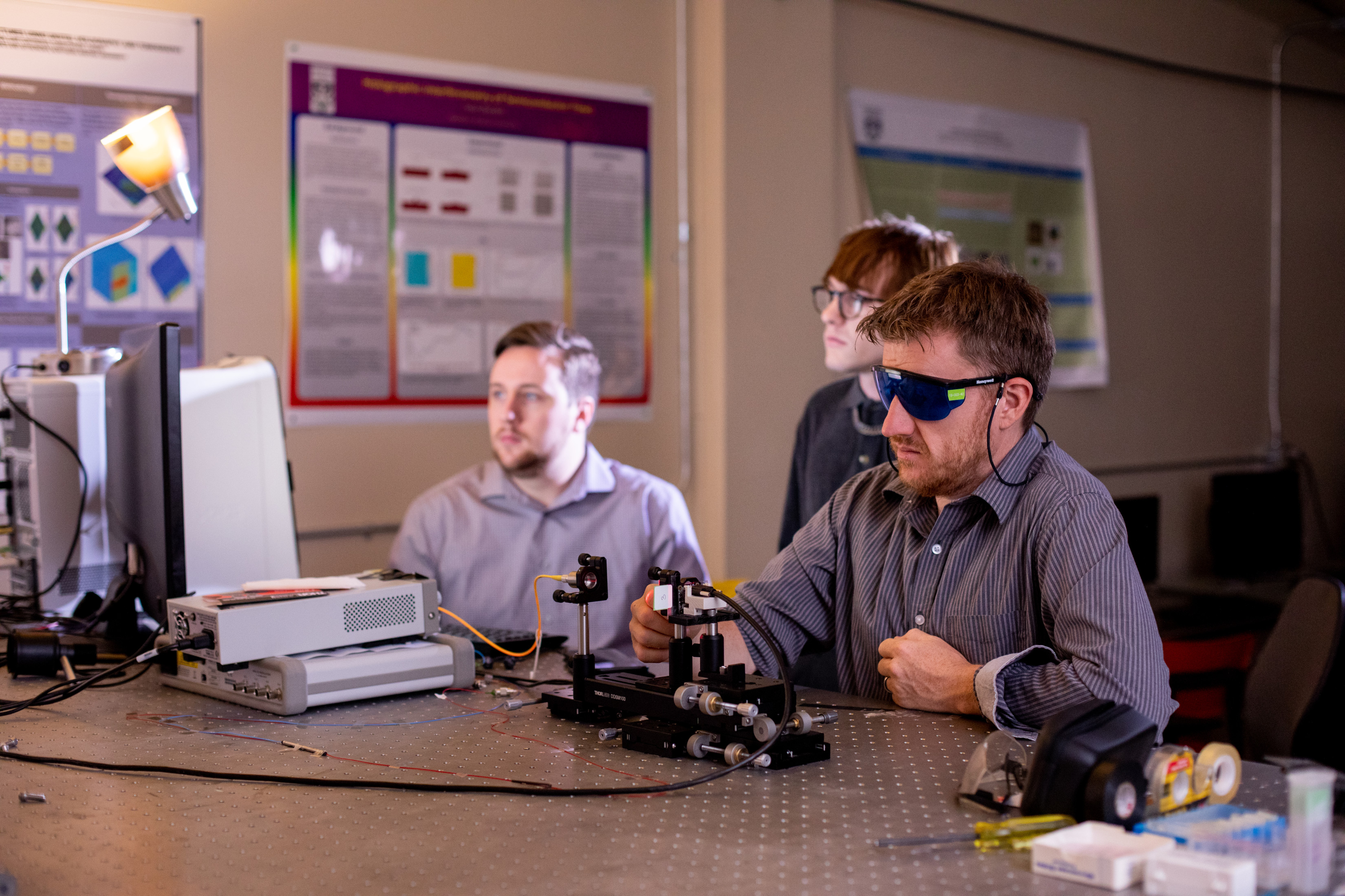 Students and colleagues working on a project