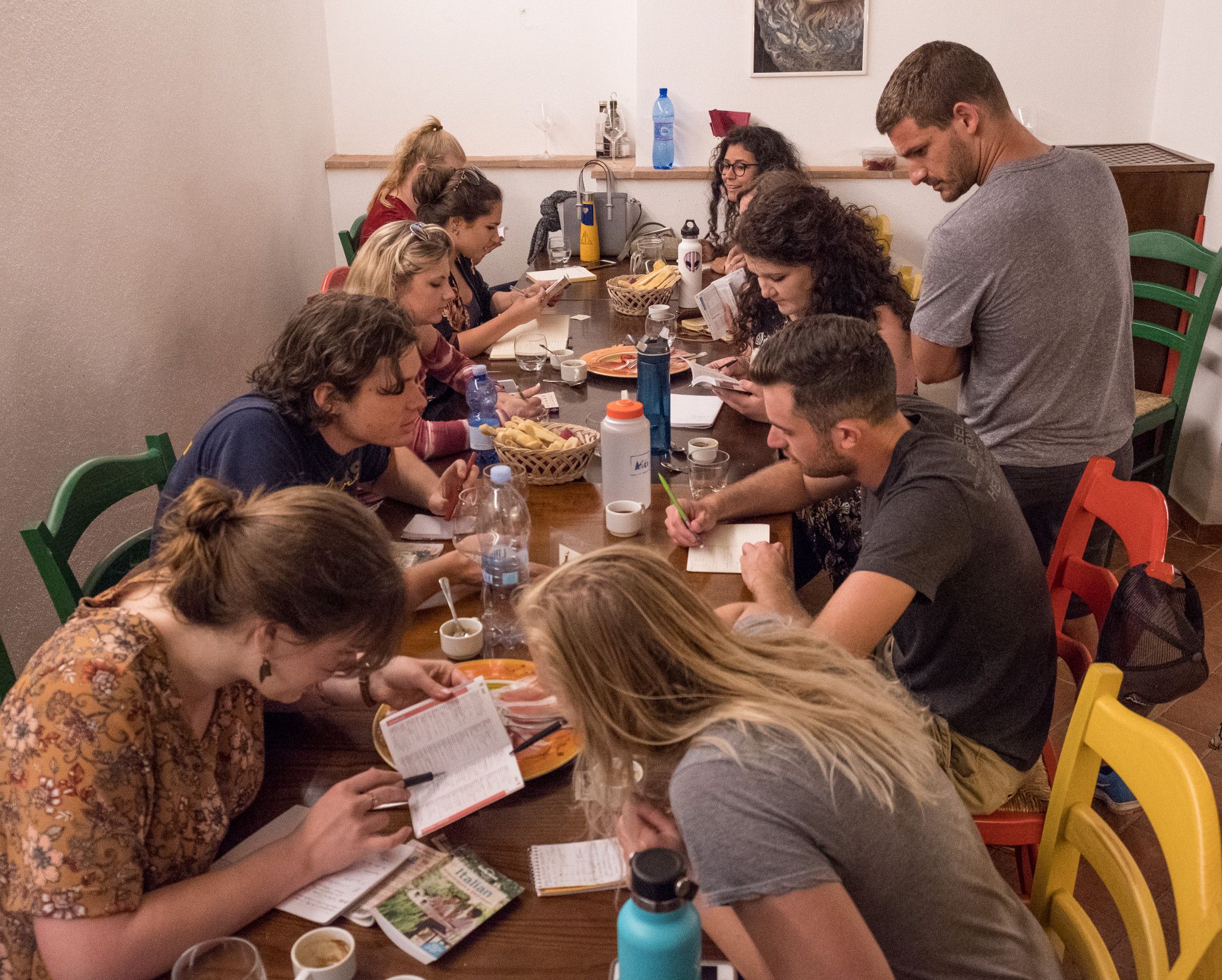 Students sitting at a table and eating with each other