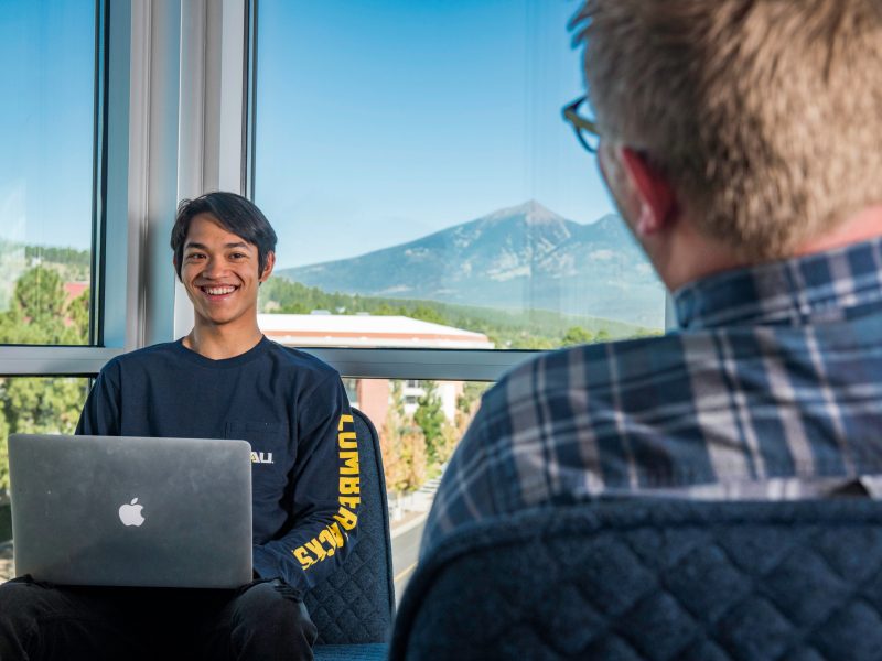 A student on his laptop at the honors building.