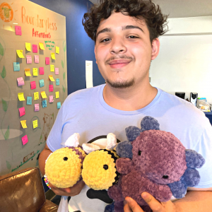NAU student, Russel Manzanarez shows off plushies from his business, Crochet Playground.