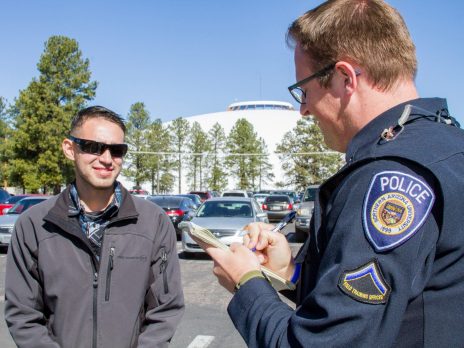 officer talking to man