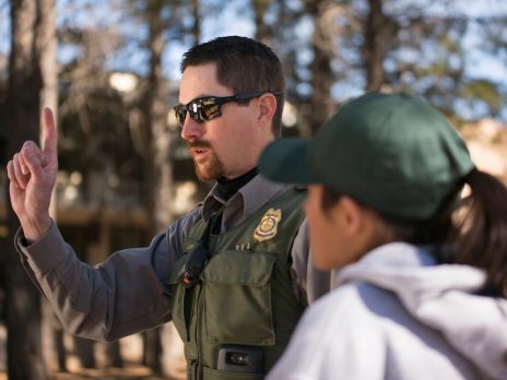 corrections officer talks to woman