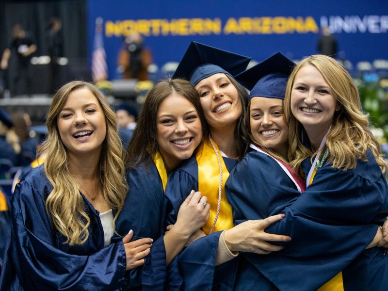 Student smiling at graduation.