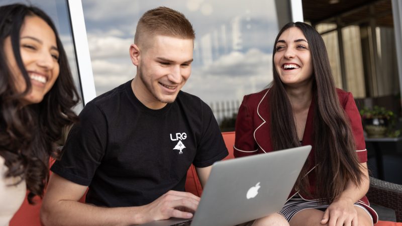 Students smile as they apply to N A U.