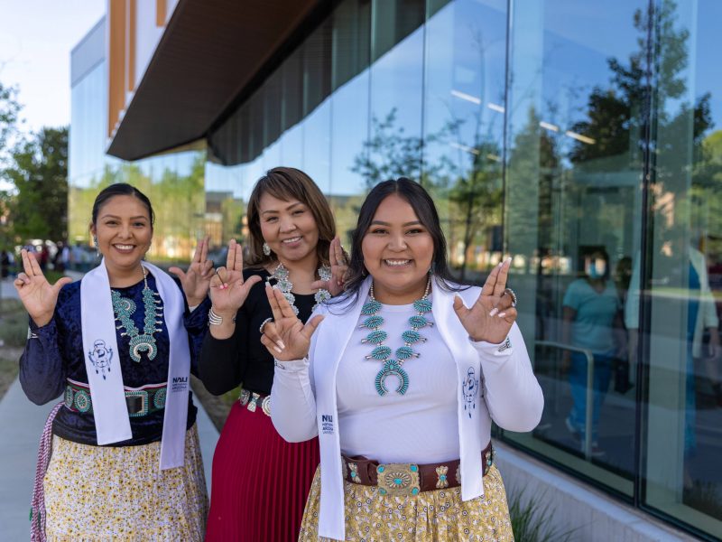 Students smile and pose during the indigenous convocation reception.