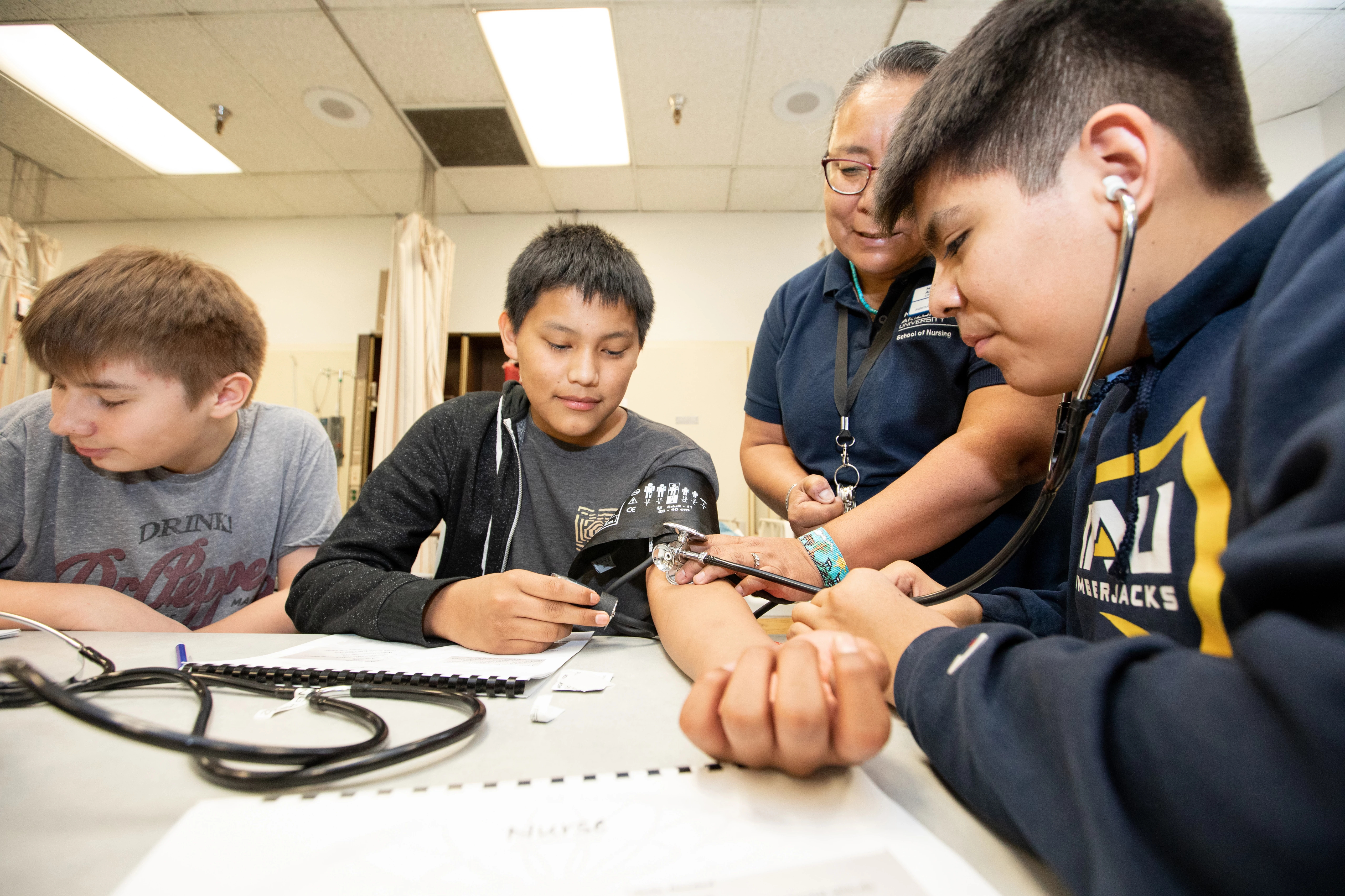 NAU nurses providing check-ups and training in indigenous communities.