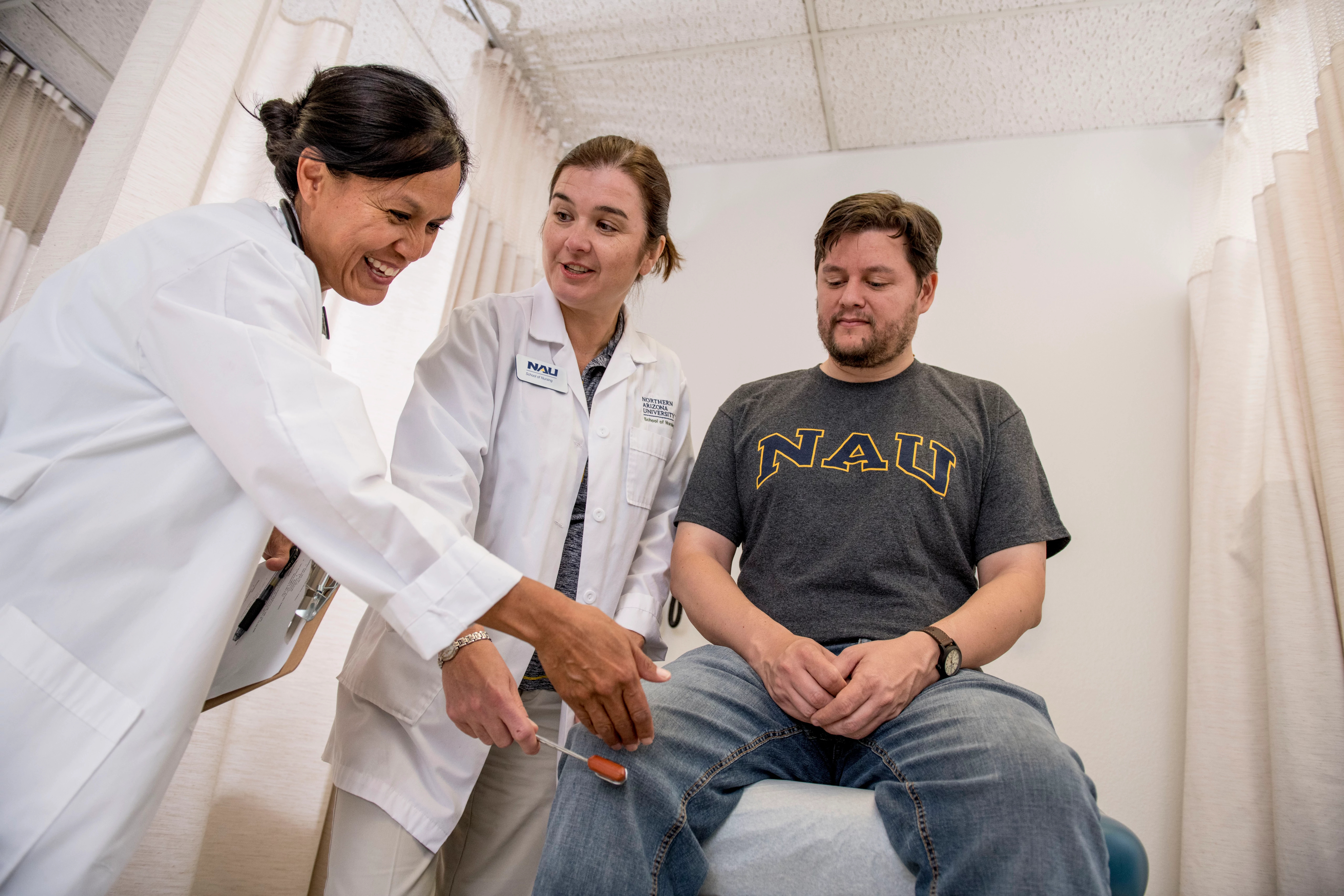 NAU Nursing graduate students trains interacting with patients with instructor guidance.