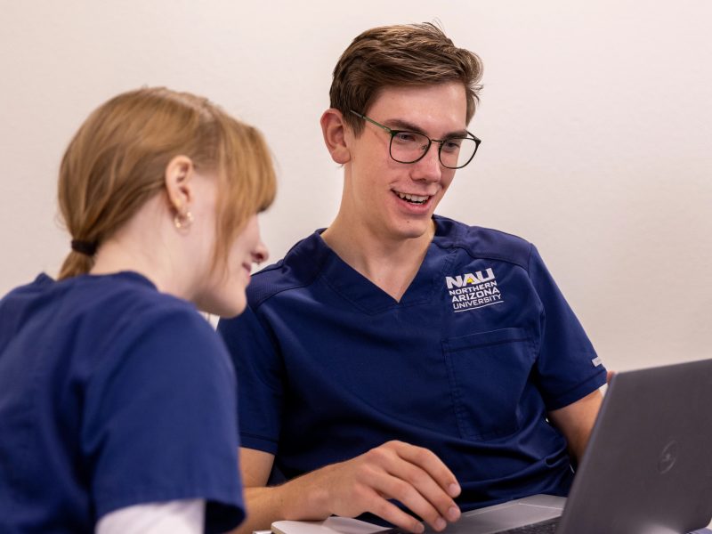 N A U Nursing students working together in class.