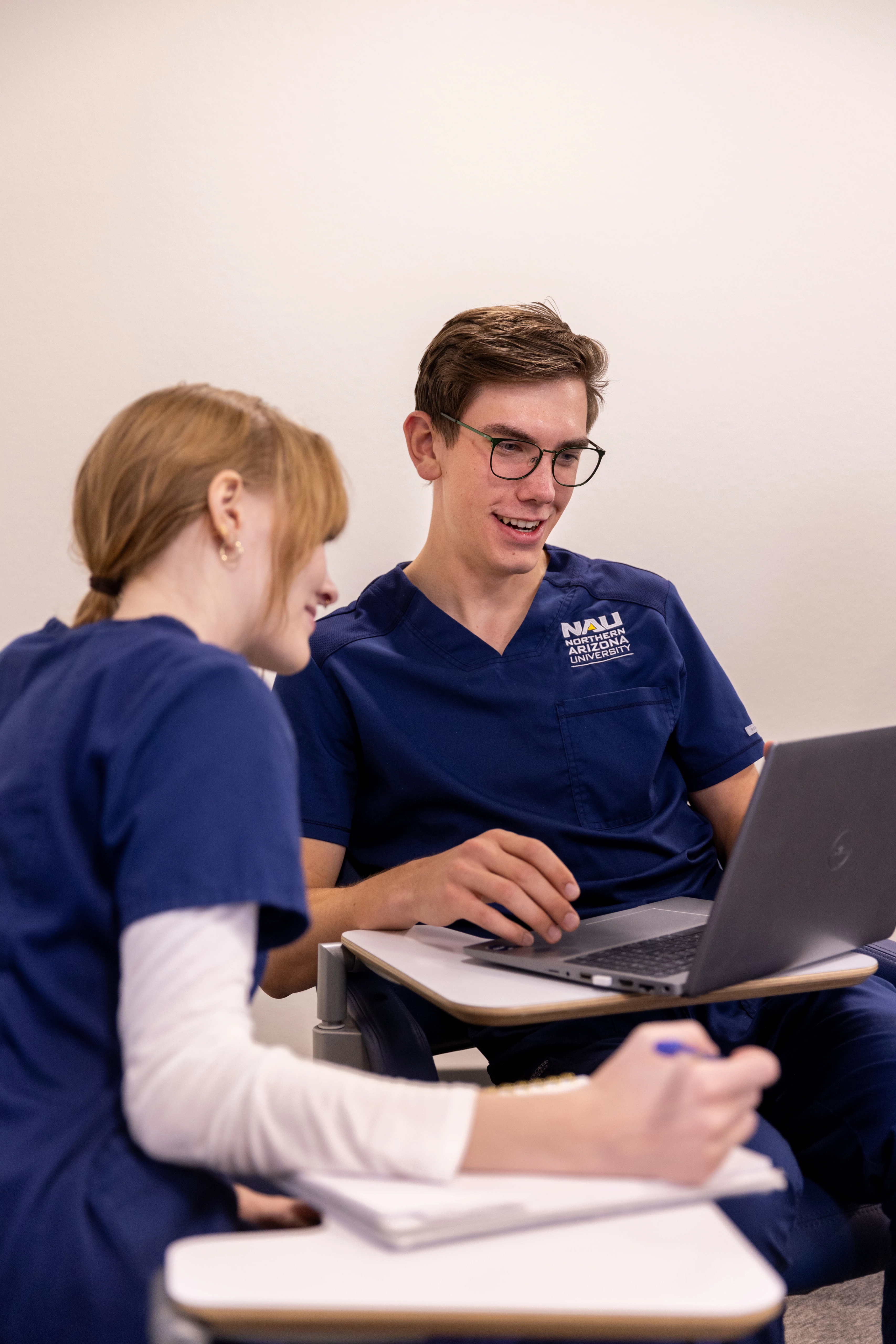 N A U Nursing students working together in class.