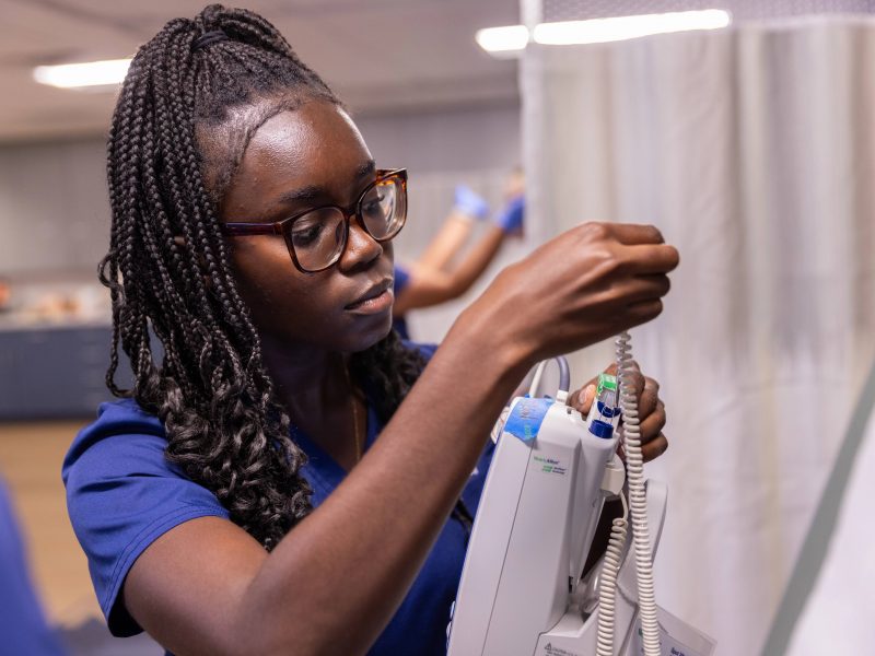 Students attending class and working as part of the College of Nursing.