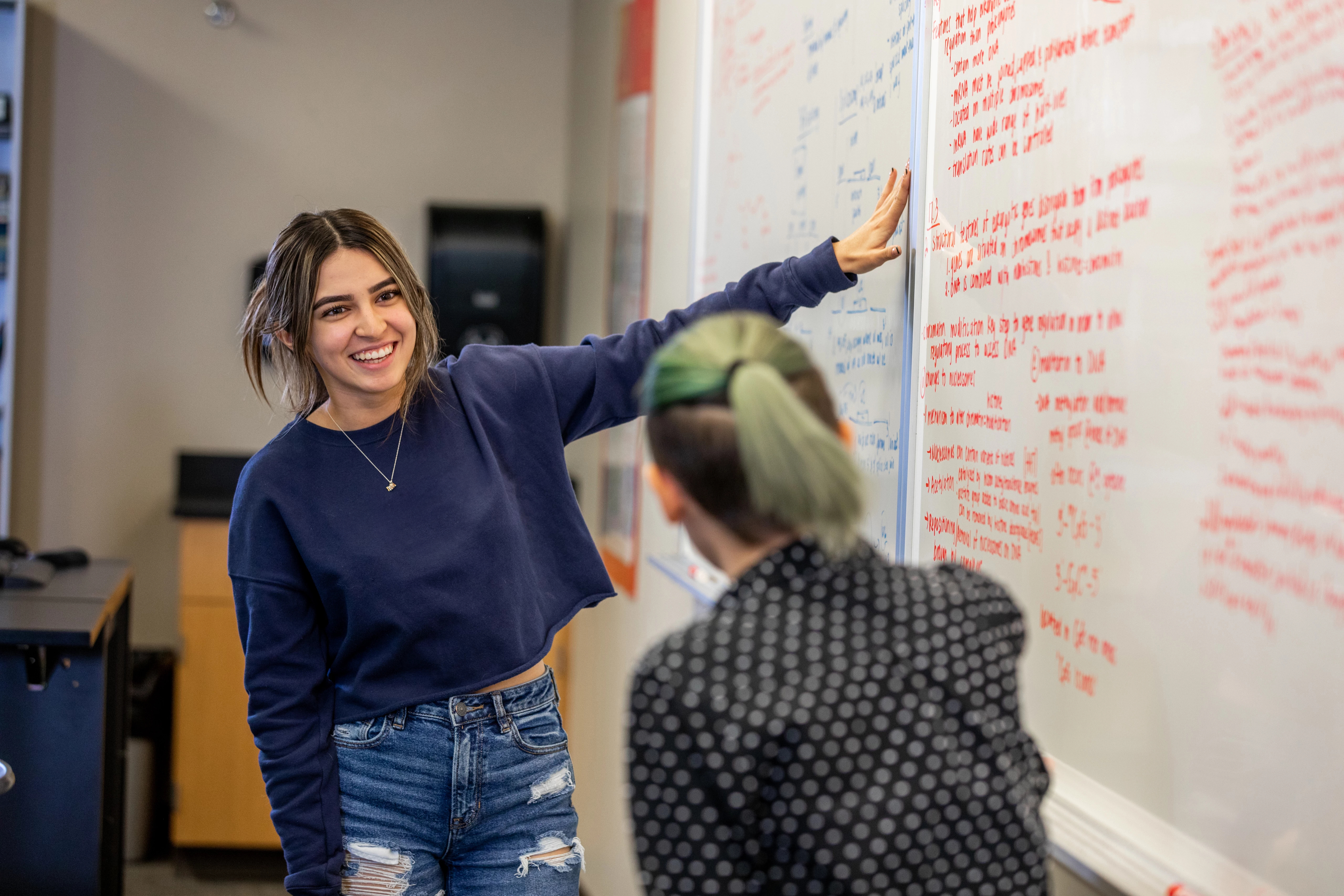 Student looking at white board.