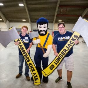 two students with Louie and axes at welcome event