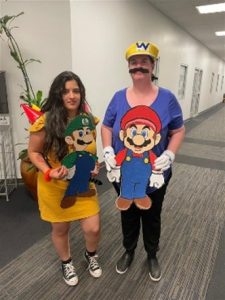 Katherine and Giselle dressed up in costume for a Super Smash event.