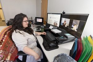 Woman sitting at computer on Zoom