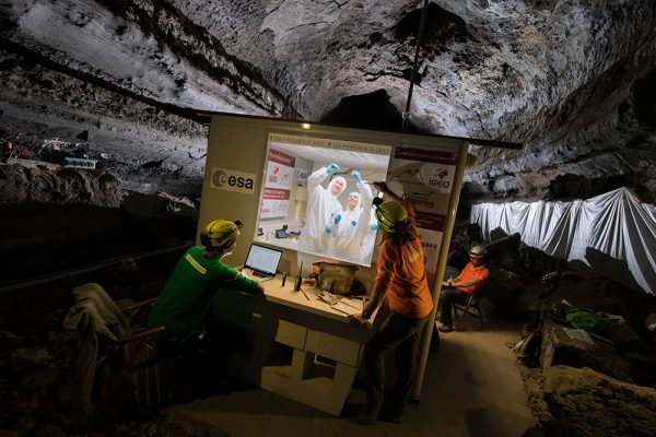 Lab with workers underground in cave