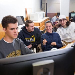 Students collaborating on a computer.