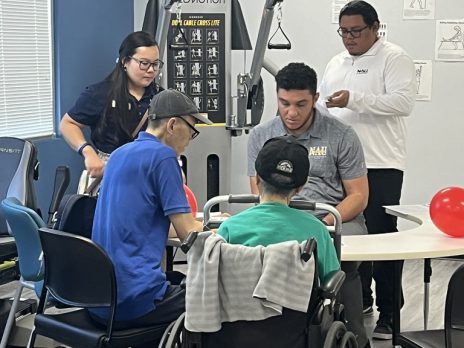 Students discuss at-home care with community members.