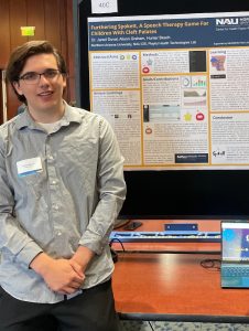 Hunter presents a poster at the 2024 Undergraduate Research Symposium.