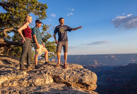 NAU faculty member and two students looking over the Grand Canyon during a field research trip