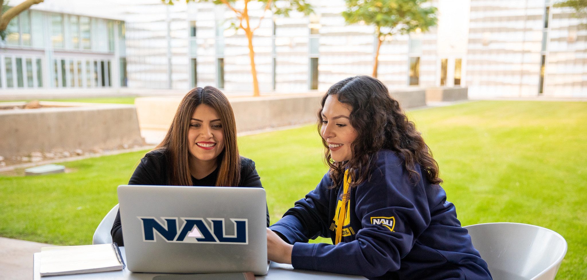 NAU–Yuma students outside working on Laptop
