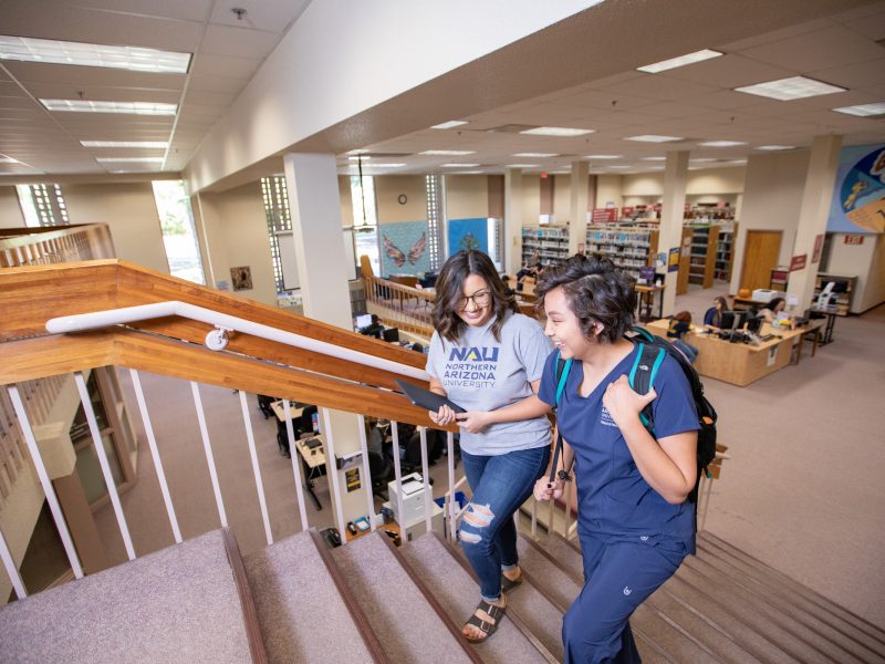 NAU–Yuma students walking in library