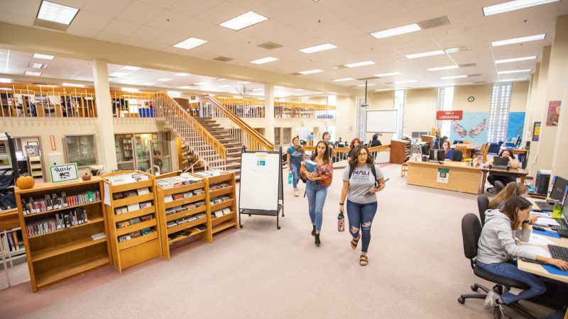 NAU students walking through the Yuma Campus library