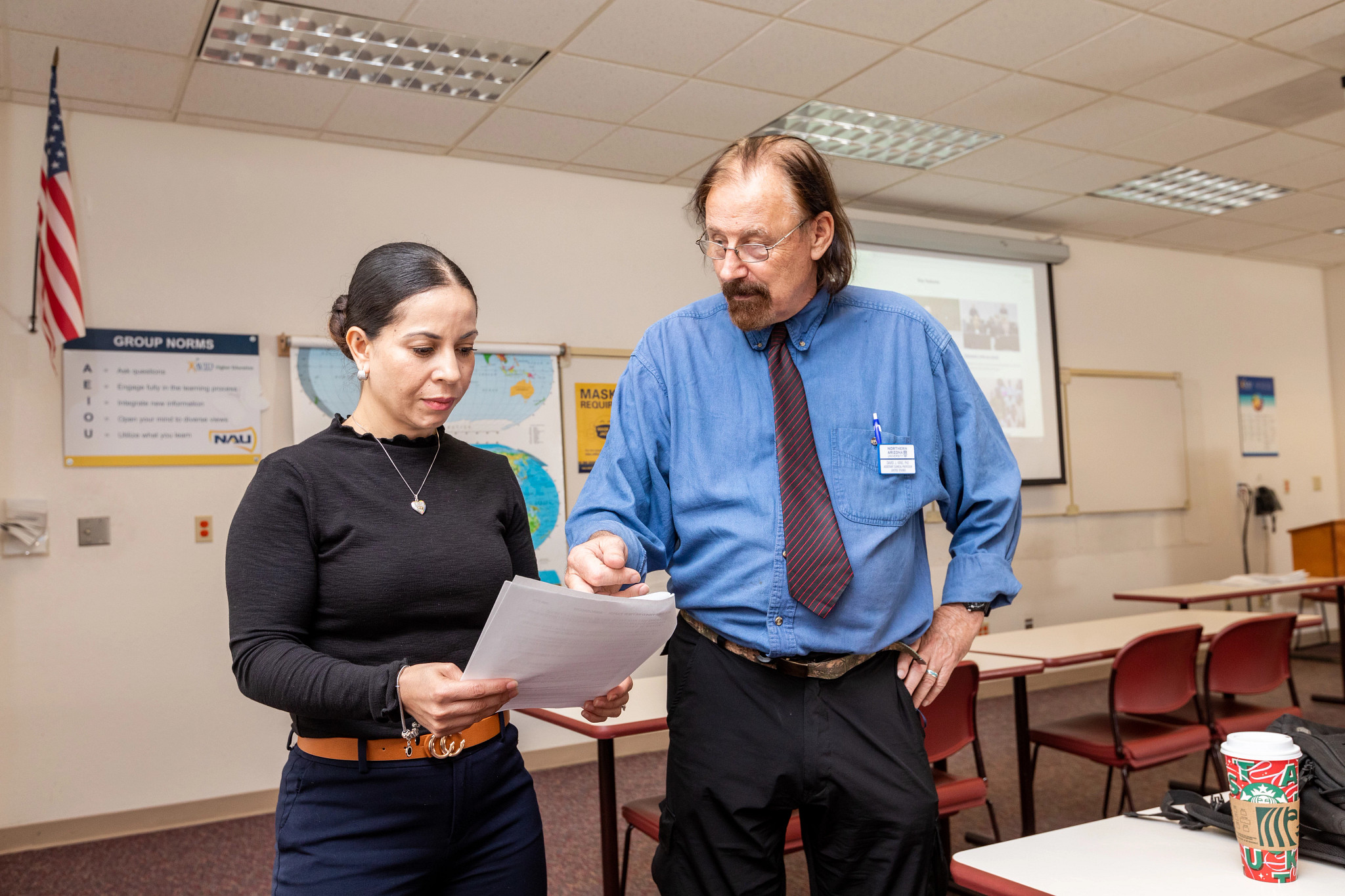 NAU–Yuma professor helping a student with work