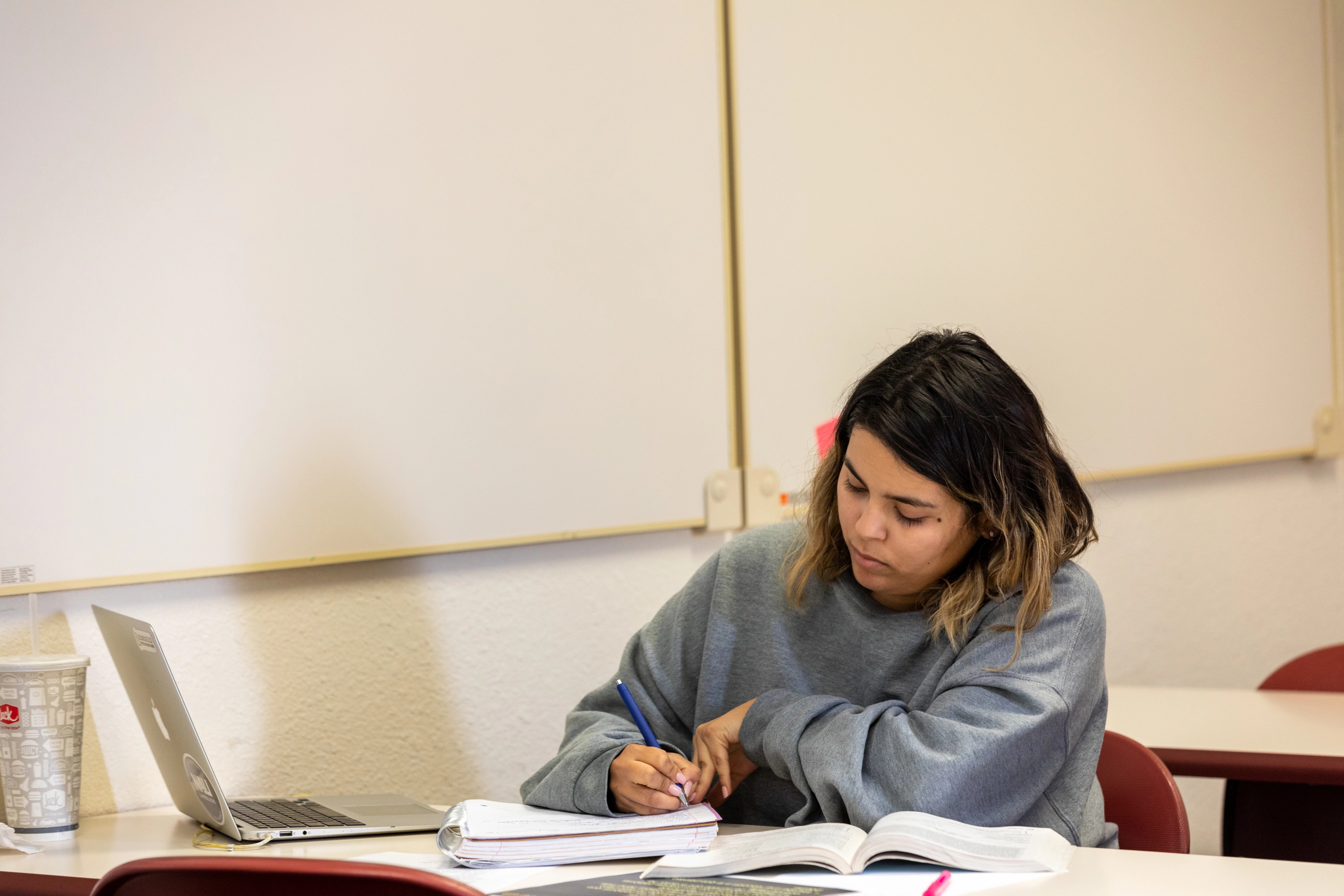 A student studying in a NAU–Yuma classroom
