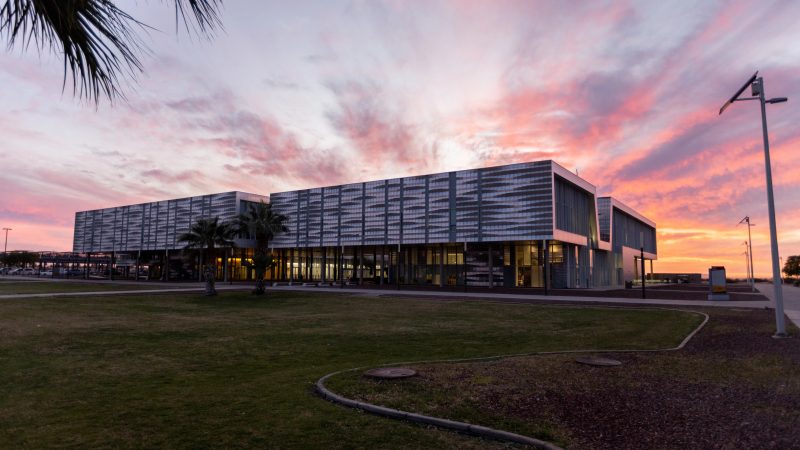 A NAU–Yuma building with the sunset in the background