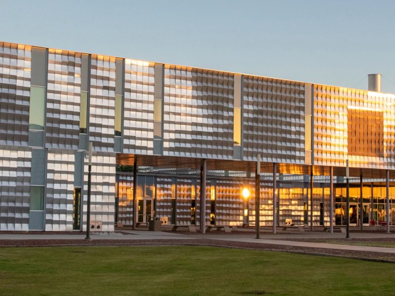 NAU–Yuma building with the sunshine reflecting from the it's panels.