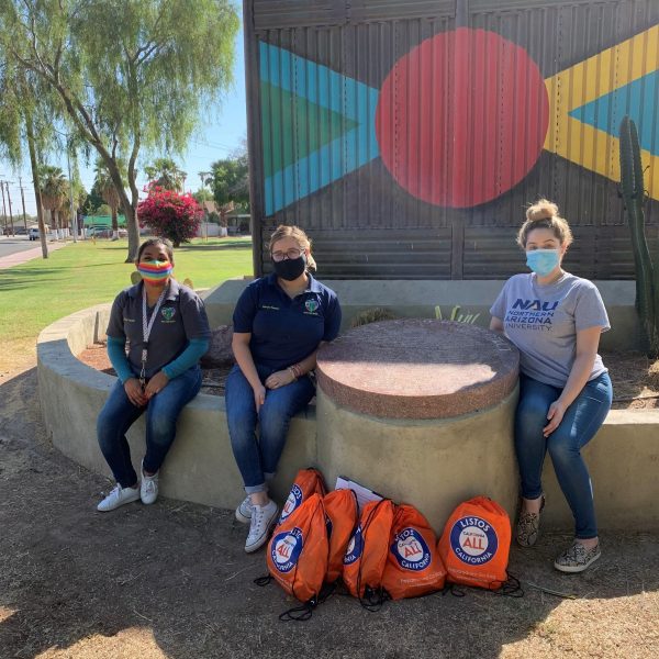 NAU–Yuma Social Work students wearing masks and sitting while doing outreach at the U.S.-Mexico border.
